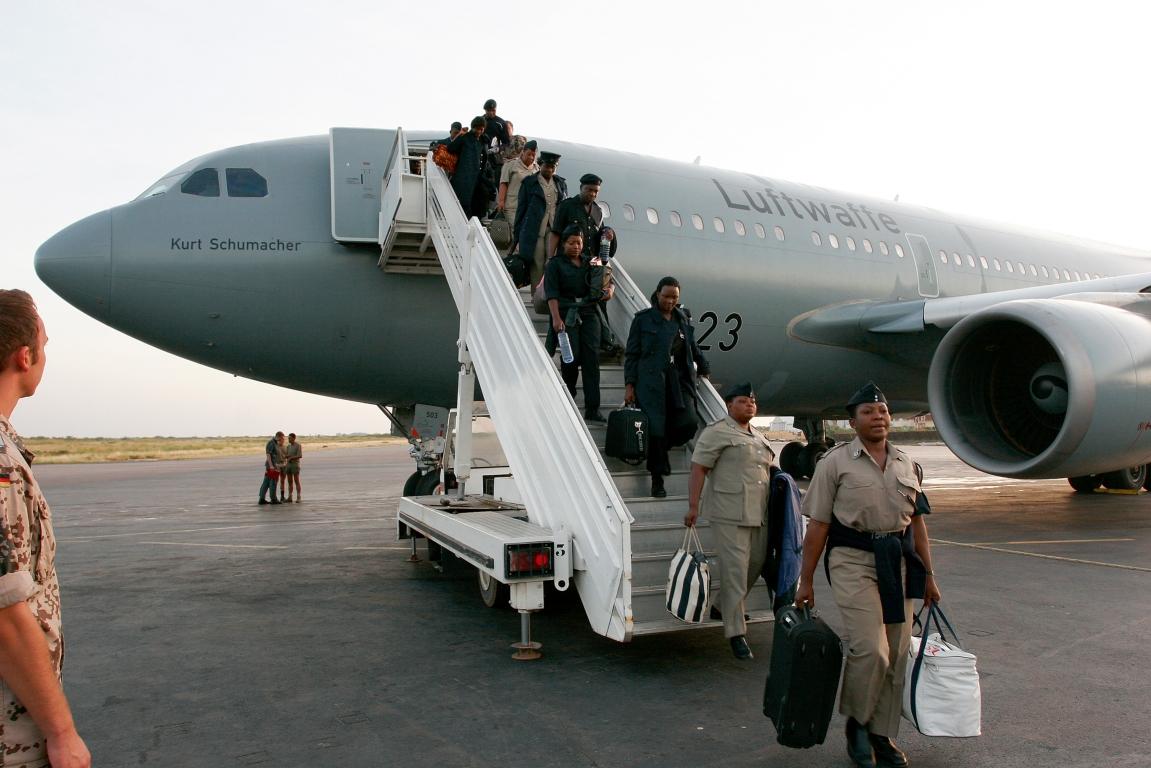 International personnel coming down the stairway